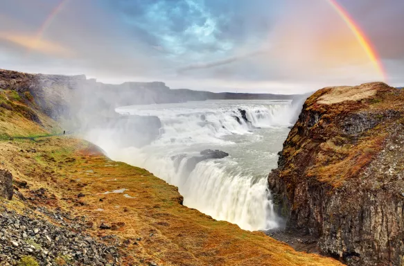 Rainbow arch  in the sky above Gullfoss waterfall, Iceland