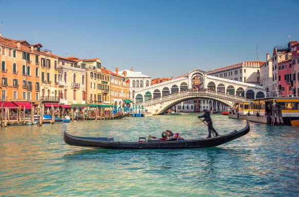 Rialto Bridge and Grand Canal with boat in Venice, Italy