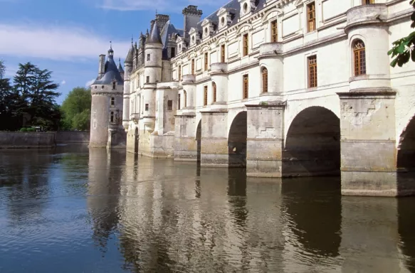 Side view of the Château de Chenonceaux and river in France