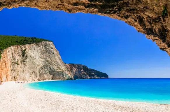 Beautiful Greek beach with turquoise waters from cave view in Lefkada, Ionian islands