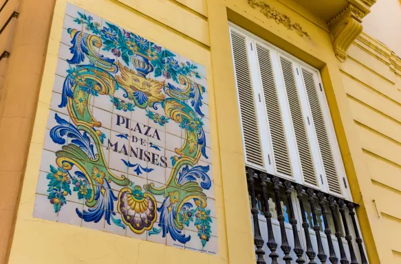 Ceramic tiles street sign of the Manises square in Valencia, Spain