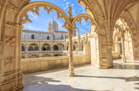 Hieronymites Monastery courtyard with church dome in background in Lisbon, Portugal