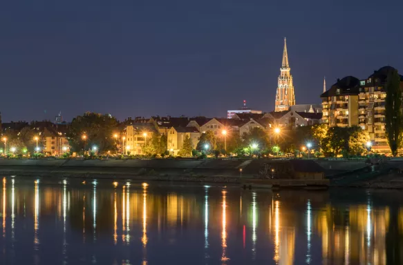 River Drva coast reflection by night in city Osijek, Croatia