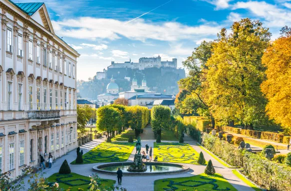 Beautiful view of famous Mirabell Gardens with the old historic Fortress Hohensalzburg in the background in Salzburg, Austria