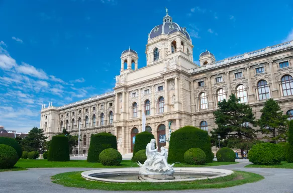 Fountain with sculptures and the Natural History Museum in Vienna, Austria