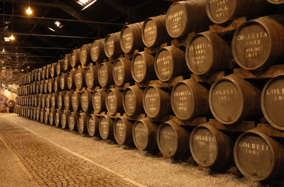 Stacks of port wine barrels in cellar at Graham's Port Lodge in Portugal