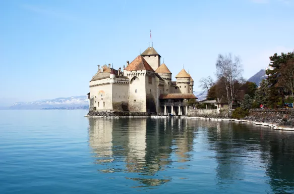 View of the château de Chillon with adjacent rocky beach in Switzerland