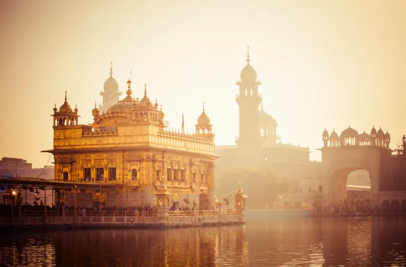 Sikh gurdwara Golden Temple during sunrise in Amritsar, Punjab, India