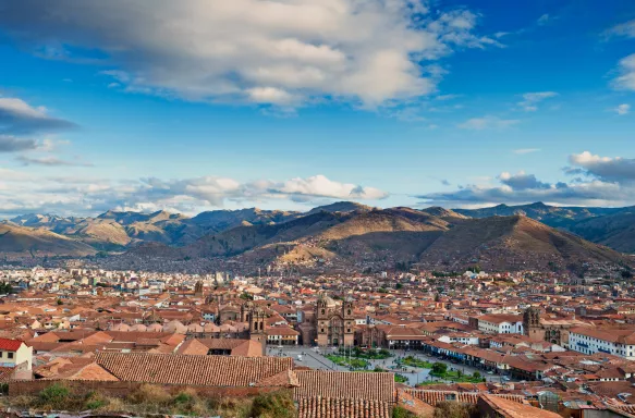 Aerial view of Cusco Main Square, Peru, with a background of the Peruvian Andes