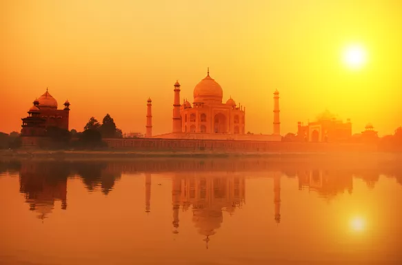 Taj Mahal at dusk with beautiful orange sky in India