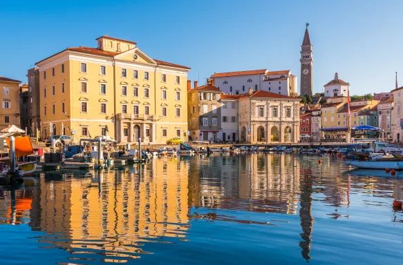 Majestic reflections of waterfront buildings of Piran