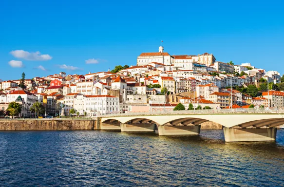 View of Coimbra city from the Mondego River in Portugal