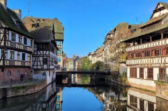 Traditional half-timbered houses along the Rhine river in Strasbourg, France