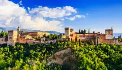 Landscape of Alhambra in Granada in Spain amid a beautiful green hilltop and blue skies