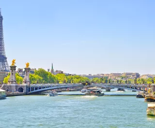 The Seine river with Alexandre III bridge and Eiffel Tower in the background