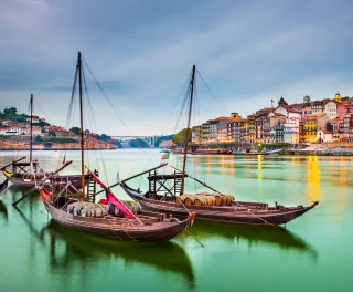 Porto cityscape on the Douro River with traditional Rabelo boats in Portugal