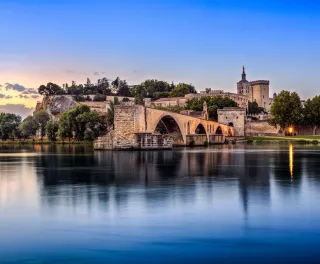 Avignon Bridge with Popes Palace and Rhone river in Pont Saint-Benezet, France