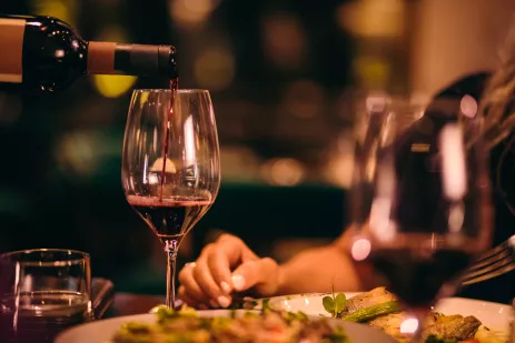 Close-up of red wine being served at fine dining restaurant