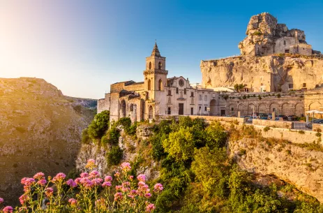 Ancient town of Matera with vegetation at sunrise in Basilicata, Italy